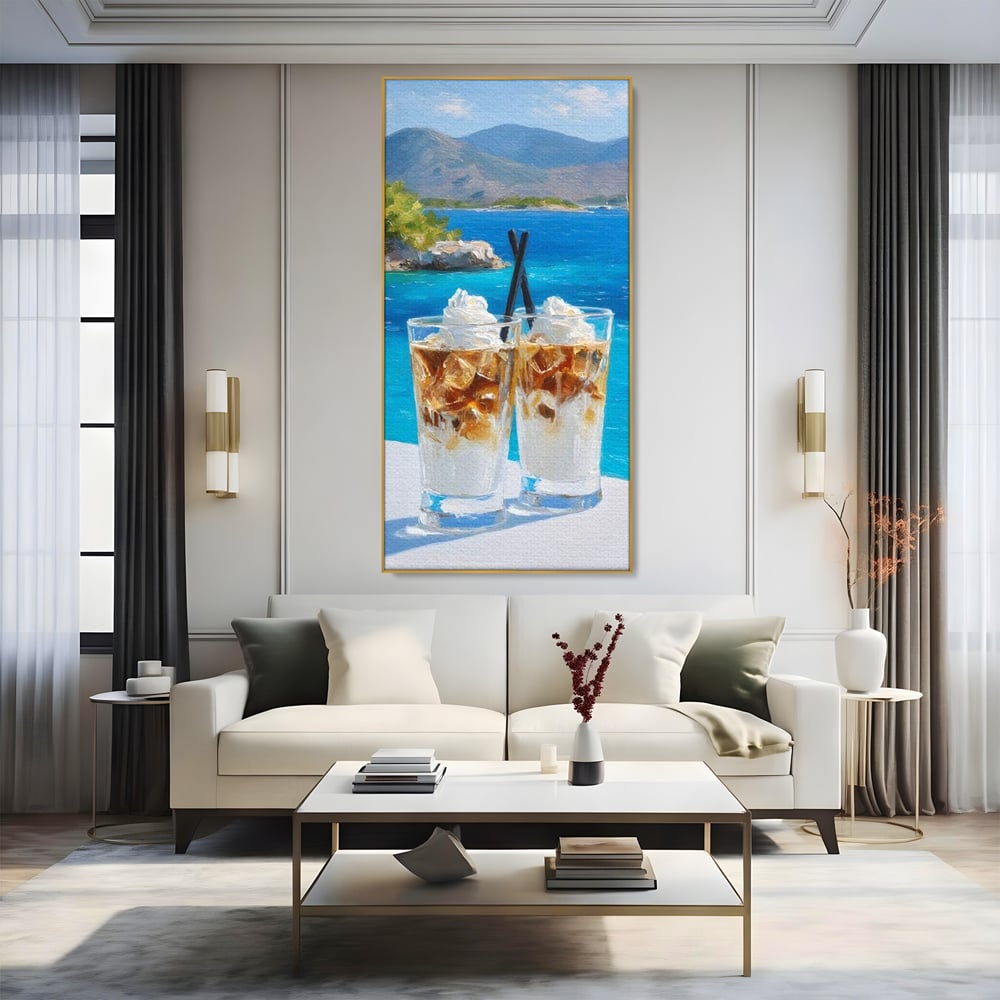 Tablou canvas cu pictura cu doua pahare de frappe pe malul marii, in rama de aluminiu auriu, pe perete intr-un living